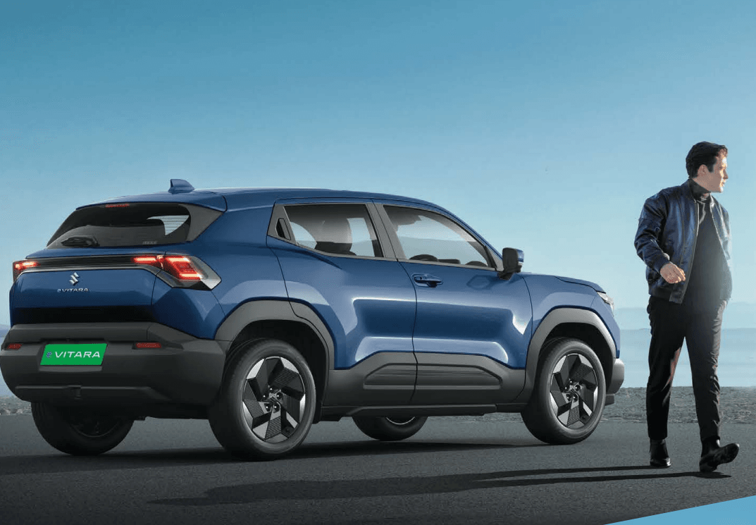 Blue SUV parked on scenic road.